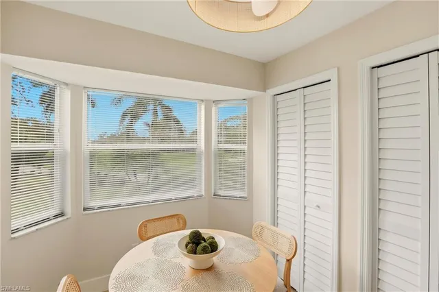 a kitchen with stainless steel appliances kitchen island granite countertop a refrigerator and a stove top oven