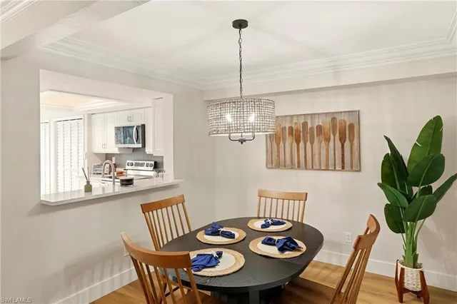 a view of a dining room and chandelier