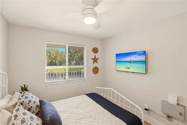 a bedroom with furniture and a window