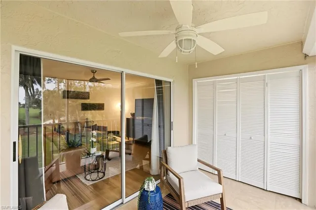 a view of a balcony with furniture