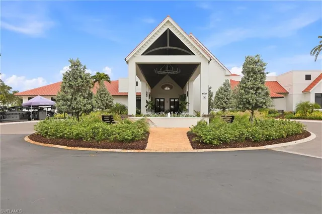 a view of a house with swimming pool and sitting area