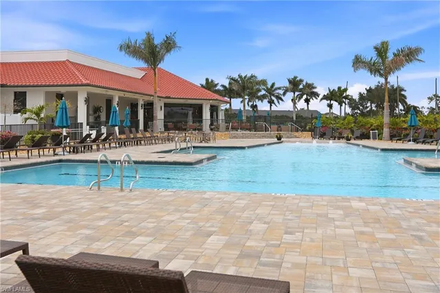a view of a swimming pool with a lounge chairs