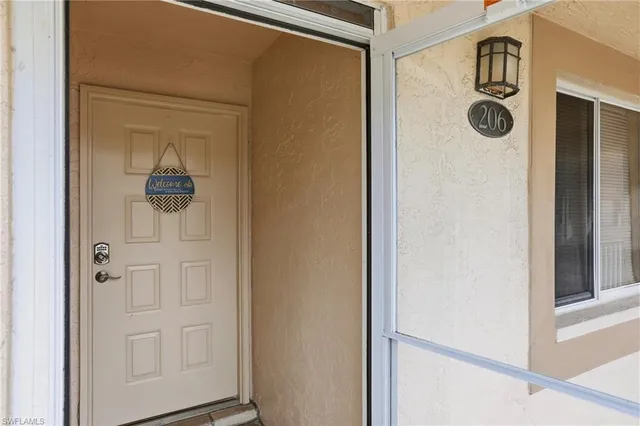 a view of a hallway with bathroom