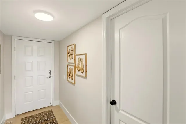 a living room with furniture a flat screen tv and a large window