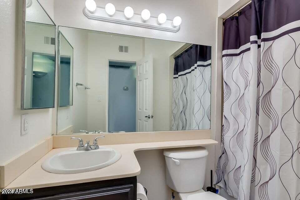 525 North May, Unit 10 Mesa, AZ 85201 - Photo 14 of 21 a bathroom with a sink vanity mirror and tub