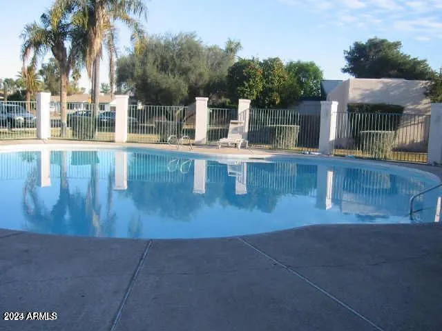 a view of fountain with a yard
