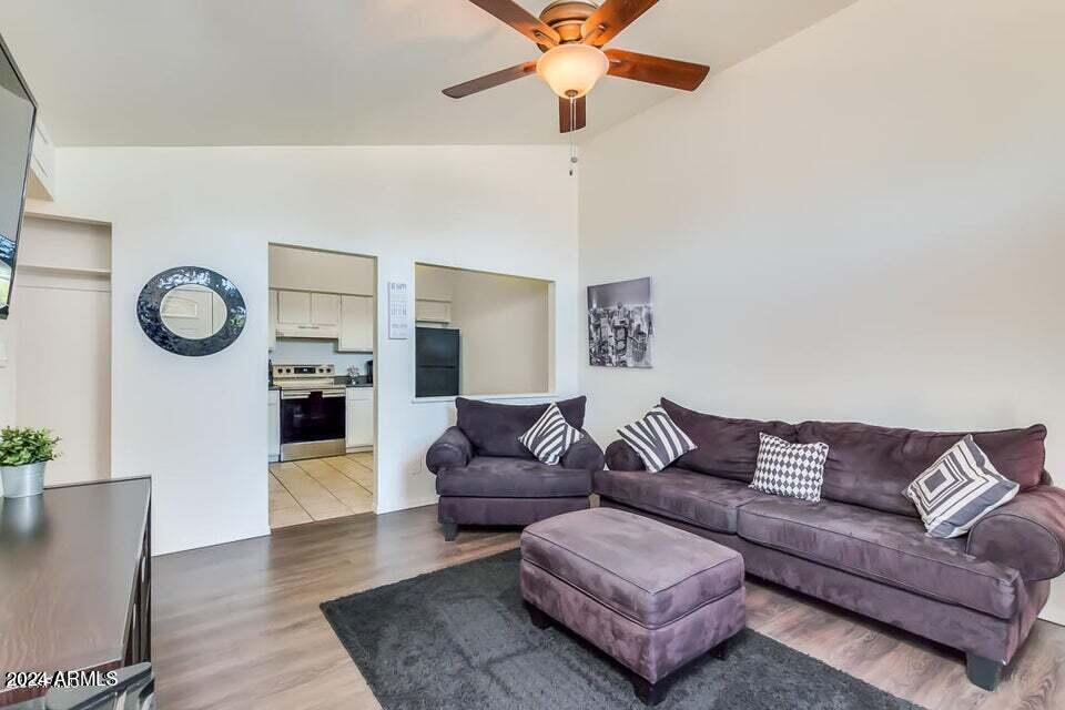 525 North May, Unit 10 Mesa, AZ 85201 - Photo 2 of 21 a living room with furniture and a fireplace