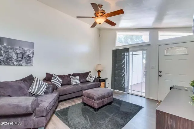 a living room with furniture and a rug