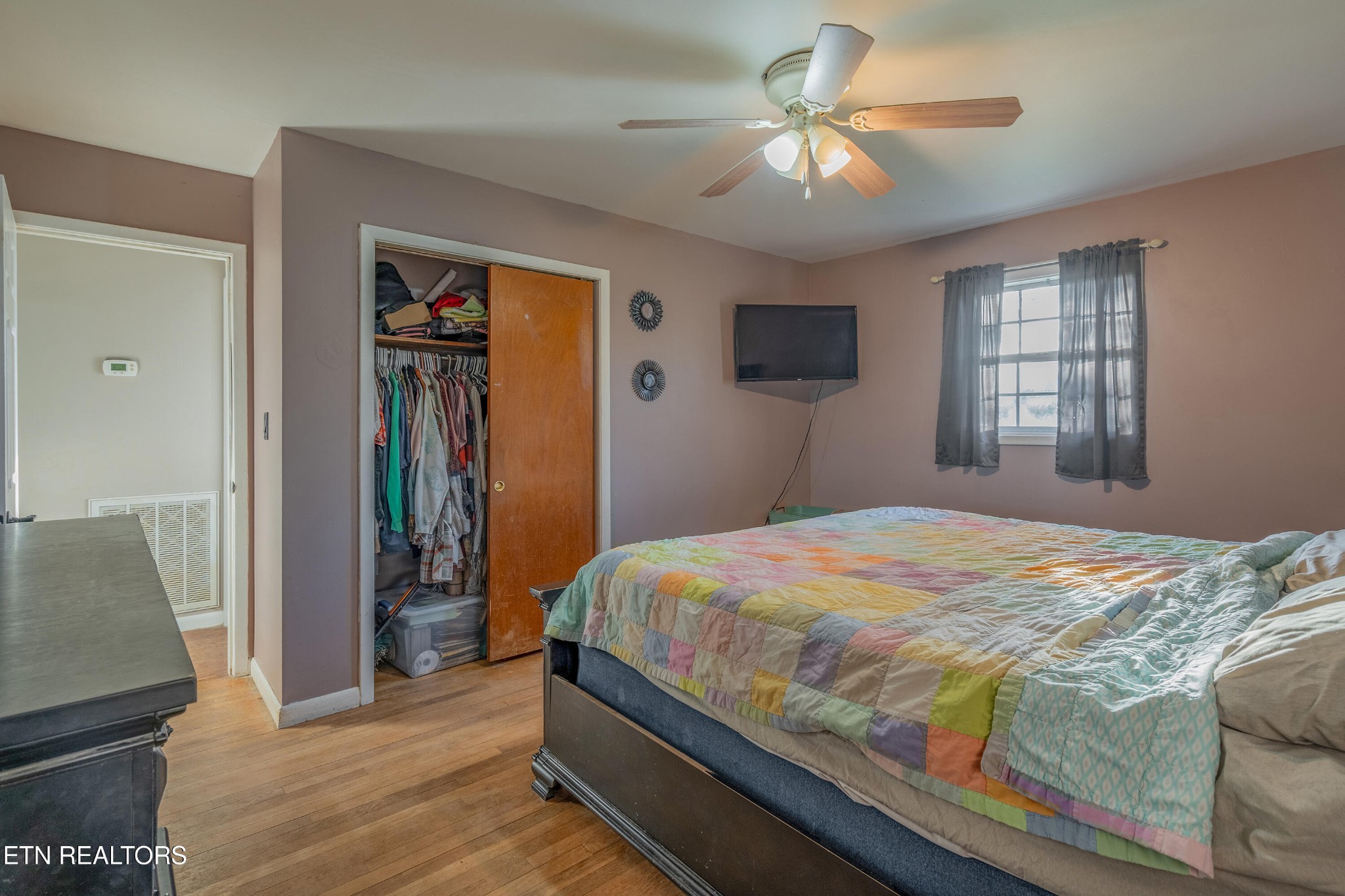 130 V F W Road Sunbright, TN 37872 - Photo 13 of 23 a bedroom with a bed and a chandelier