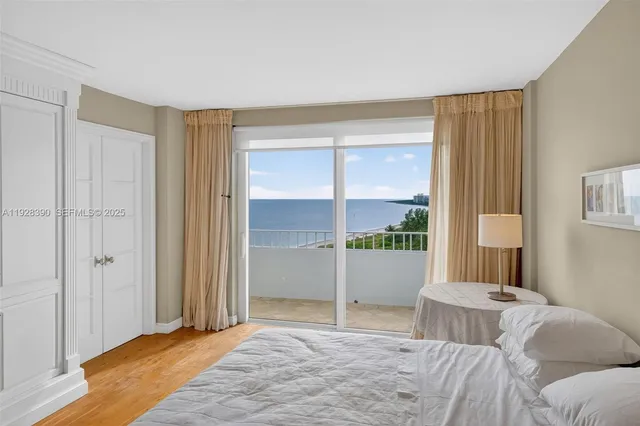a view of bedroom with furniture and wooden floor