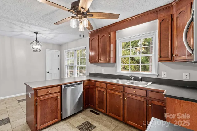 a kitchen that has a sink and a stove