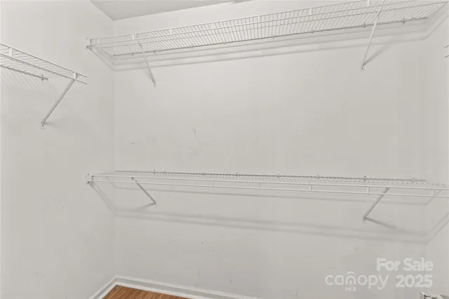 a view of a room with racks on the wall