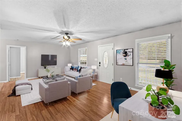 a living room with furniture and a large window