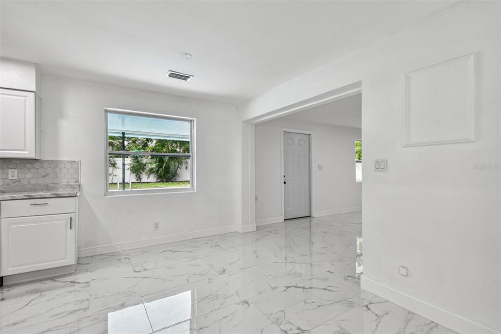 6016 Arthur Avenue New Port Richey, FL 34653 - Photo 17 of 33 a view of an empty room with window and bathroom