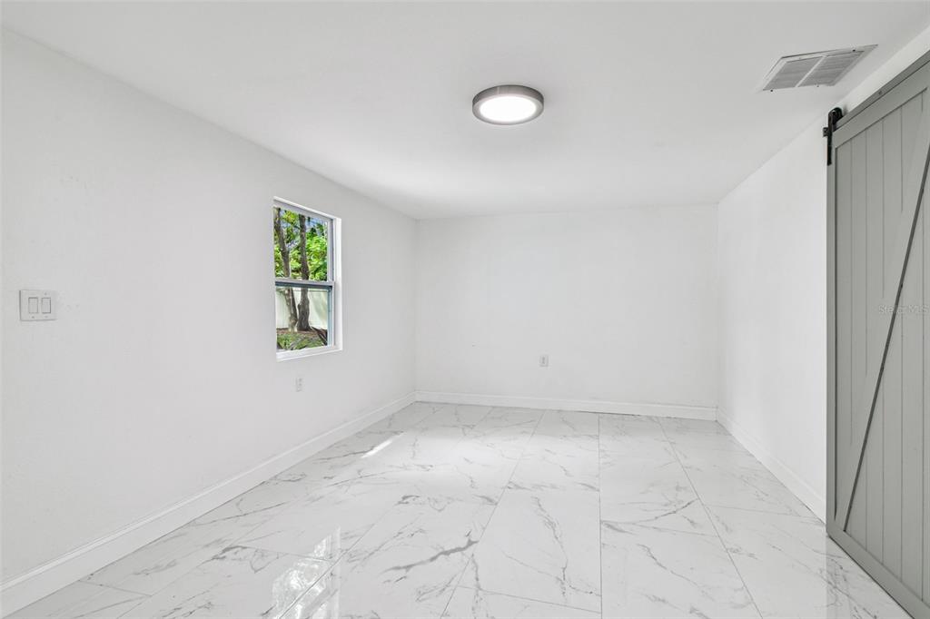 6016 Arthur Avenue New Port Richey, FL 34653 - Photo 22 of 33 an empty room with windows