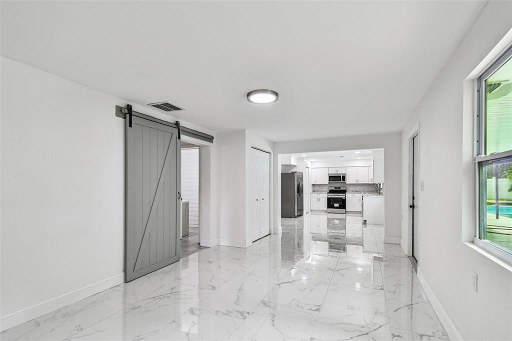 6016 Arthur Avenue New Port Richey, FL 34653 - Photo 23 of 33 a view of a hallway with a living room