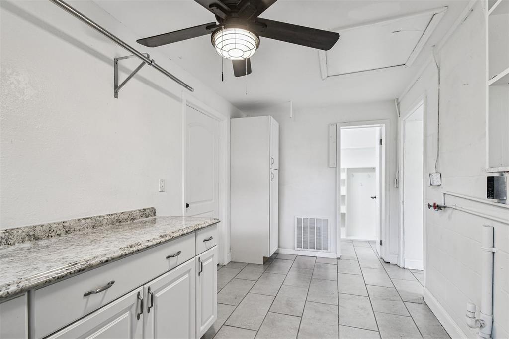 6016 Arthur Avenue New Port Richey, FL 34653 - Photo 26 of 33 a spacious bathroom with a granite countertop sink a mirror and shower