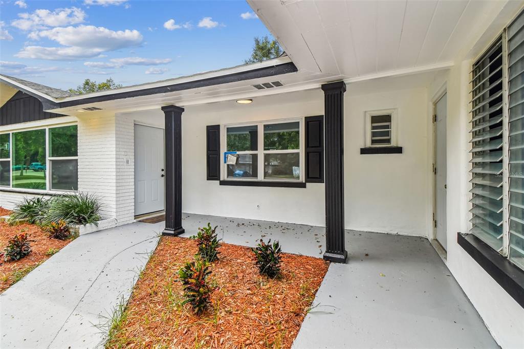 6016 Arthur Avenue New Port Richey, FL 34653 - Photo 3 of 33 front view of a house with a yard