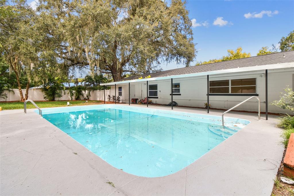 6016 Arthur Avenue New Port Richey, FL 34653 - Photo 32 of 33 swimming pool view with a outdoor seating