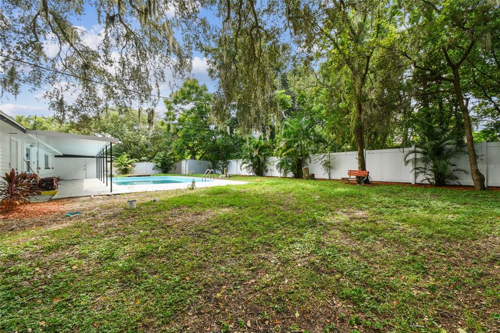 6016 Arthur Avenue New Port Richey, FL 34653 - Photo 33 of 33 a view of a house with a yard and sitting area