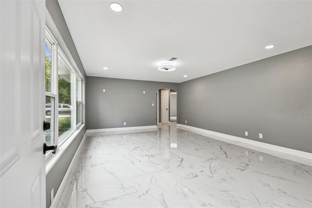 6016 Arthur Avenue New Port Richey, FL 34653 - Photo 4 of 33 a view of an empty room with a window
