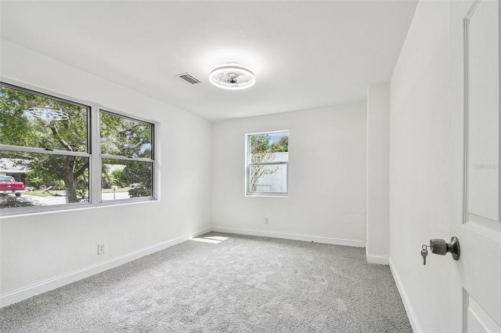 6016 Arthur Avenue New Port Richey, FL 34653 - Photo 7 of 33 an empty room with windows