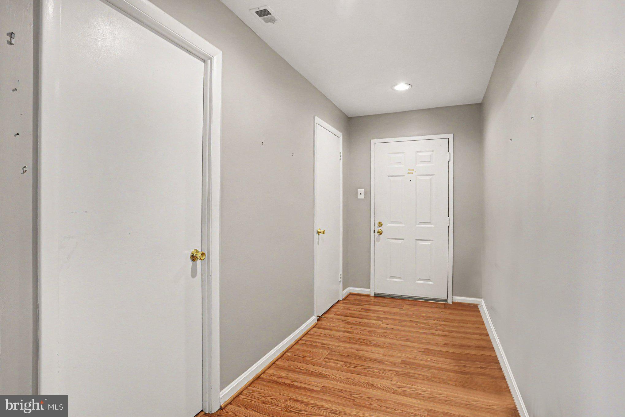 3021 Fallstaff Road, Unit 208B Baltimore, MD 21209 - Photo 9 of 25 a view of a hallway with wooden floor