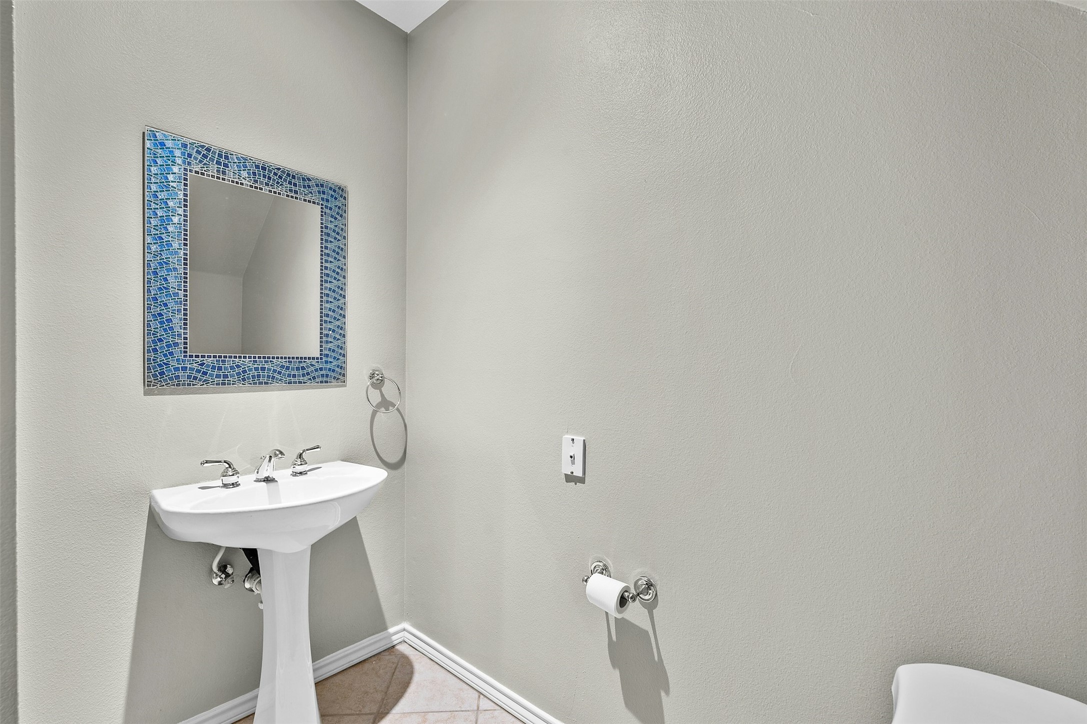 2918 Ranch To Market Road 620, Unit W219 Austin, TX 78734 - Photo 30 of 35 A mosaic mirror adds a pop of personality to this conveniently located half bath downstairs.
