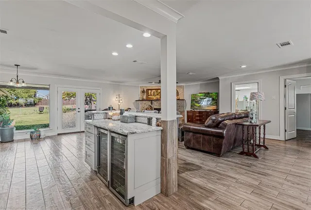 a kitchen with a sink refrigerator and cabinets