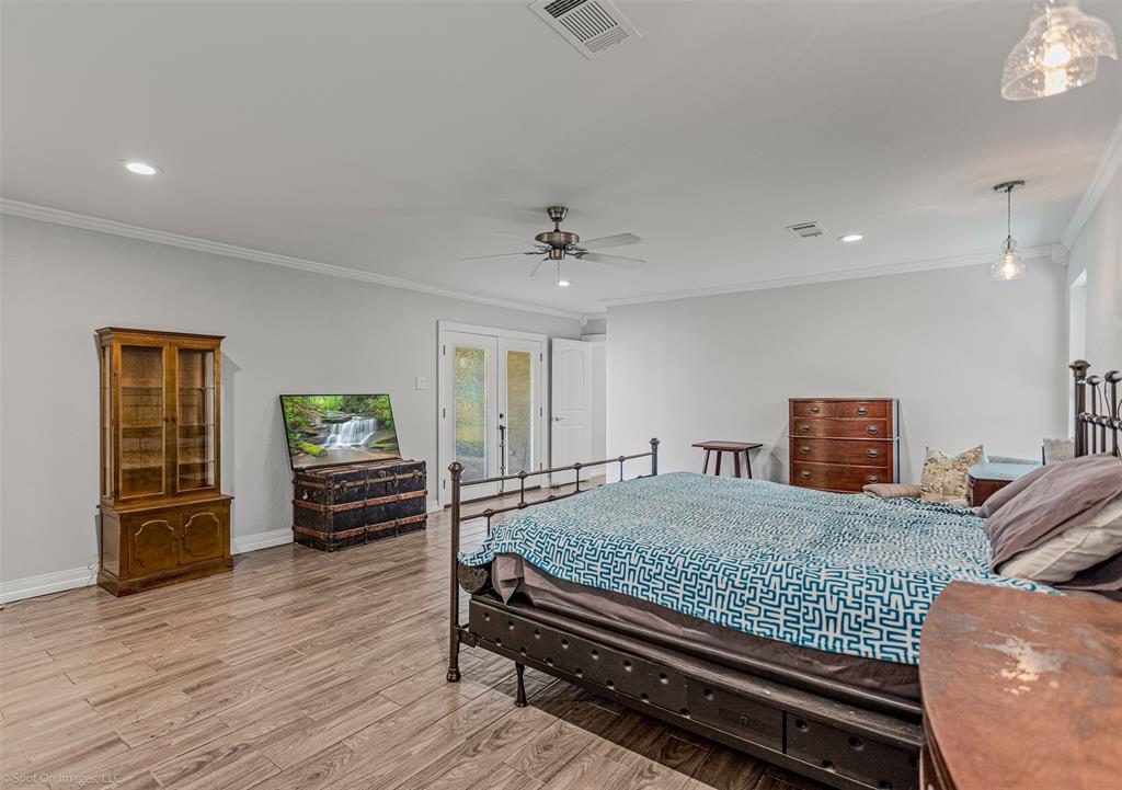 3713 Hickox Road Rowlett, TX 75089 - Photo 13 of 39 a bedroom with furniture and wooden floor