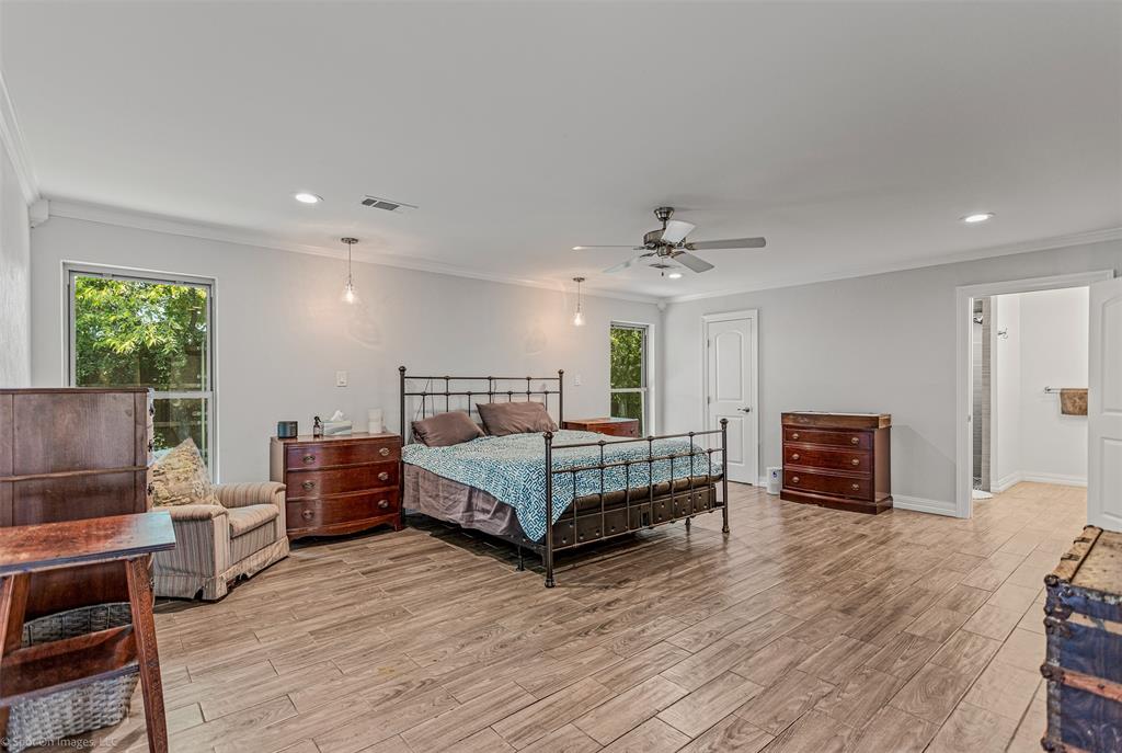 3713 Hickox Road Rowlett, TX 75089 - Photo 14 of 36 a bedroom with furniture and wooden floor