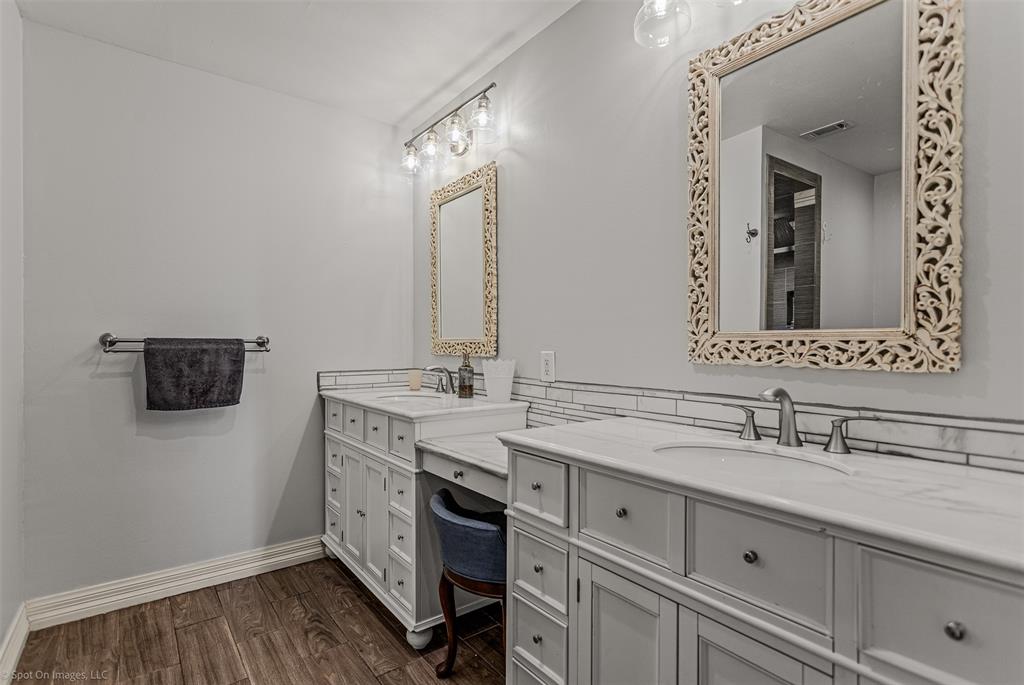 3713 Hickox Road Rowlett, TX 75089 - Photo 16 of 36 a bathroom with a double vanity sink and mirror