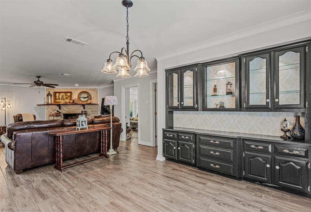 3713 Hickox Road Rowlett, TX 75089 - Photo 20 of 36 a large kitchen with stainless steel appliances granite countertop a stove and a wooden floors