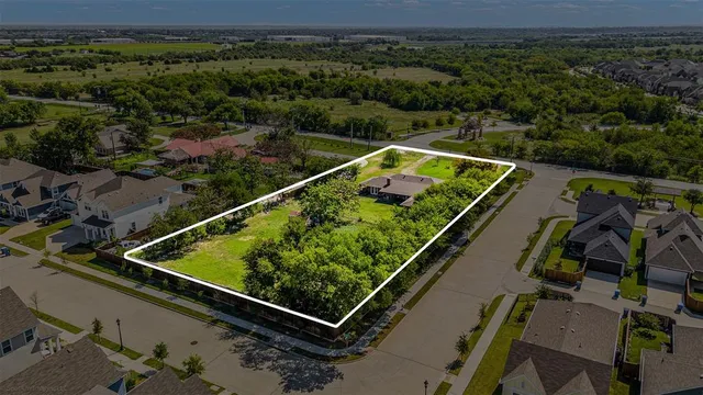 an aerial view of multiple houses with yard