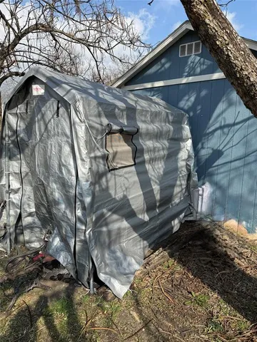 a view of backyard of a house