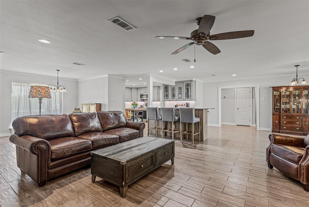 3713 Hickox Road Rowlett, TX 75089 - Photo 9 of 36 a living room with furniture and a wooden floor