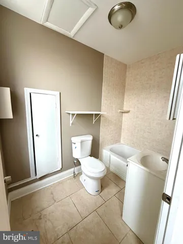 a view of a bathroom from a hallway
