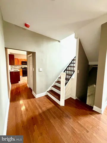 a view of a living room with a wooden floor