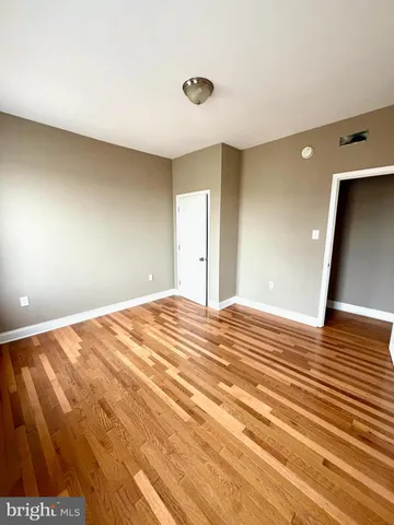 a bedroom with a bed and lamp