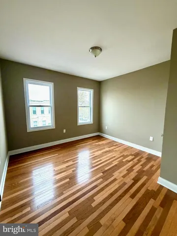a bathroom with a sink mirror and toilet