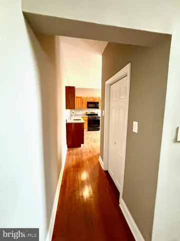 a kitchen with granite countertop a sink and a stove top oven