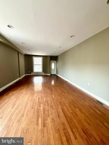 a front view of a building with sitting area