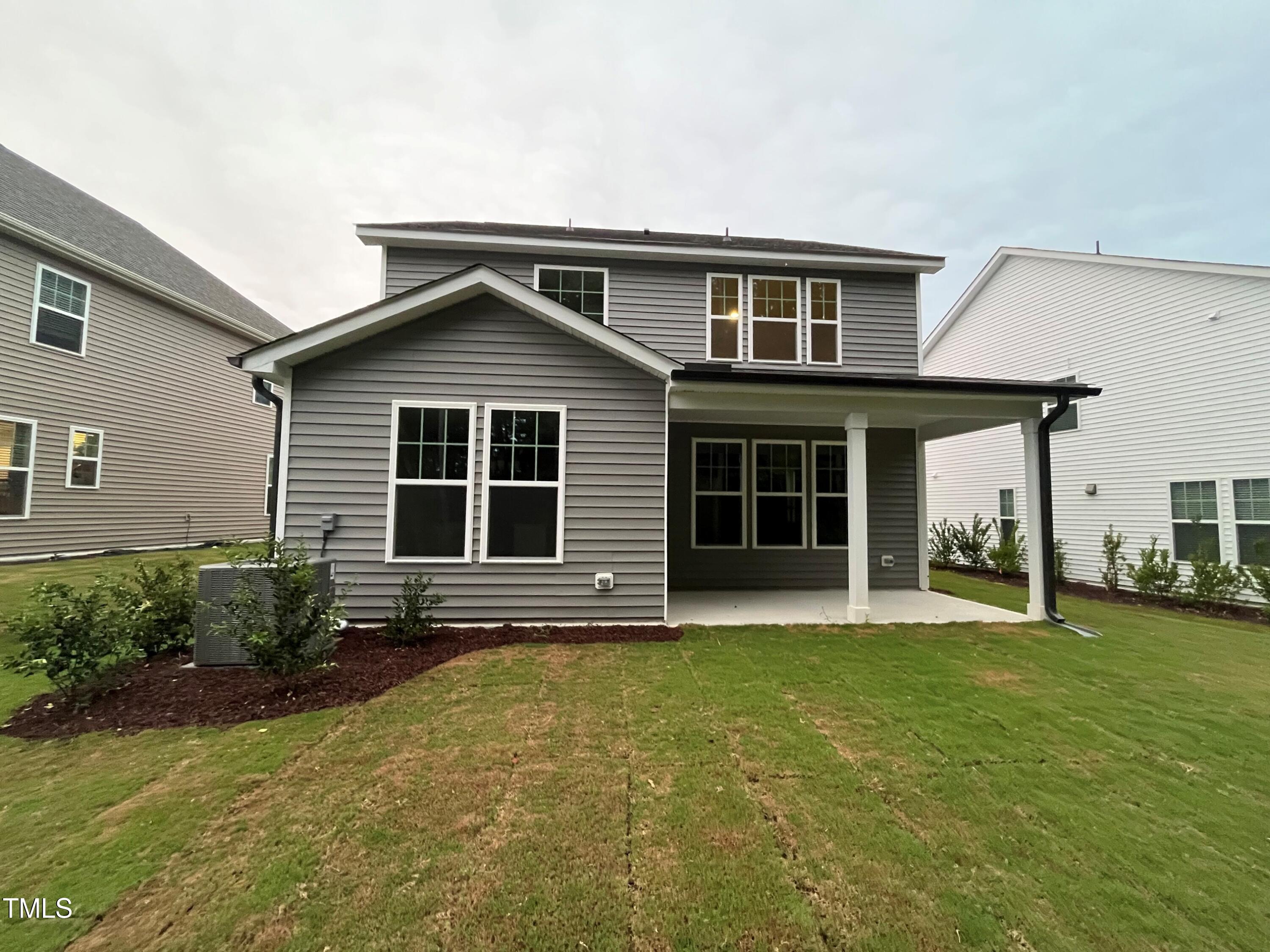 5108 River Sand Trail Raleigh, NC 27604 - Photo 2 of 59 a front view of a house with a garden and porch