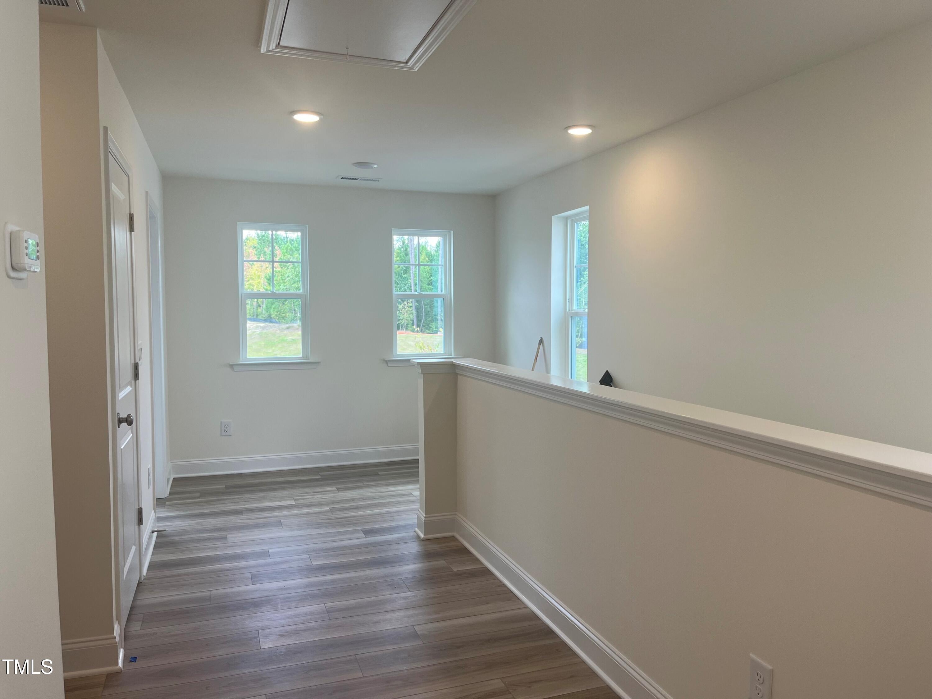 5108 River Sand Trail Raleigh, NC 27604 - Photo 31 of 59 an empty room with wooden floor and windows