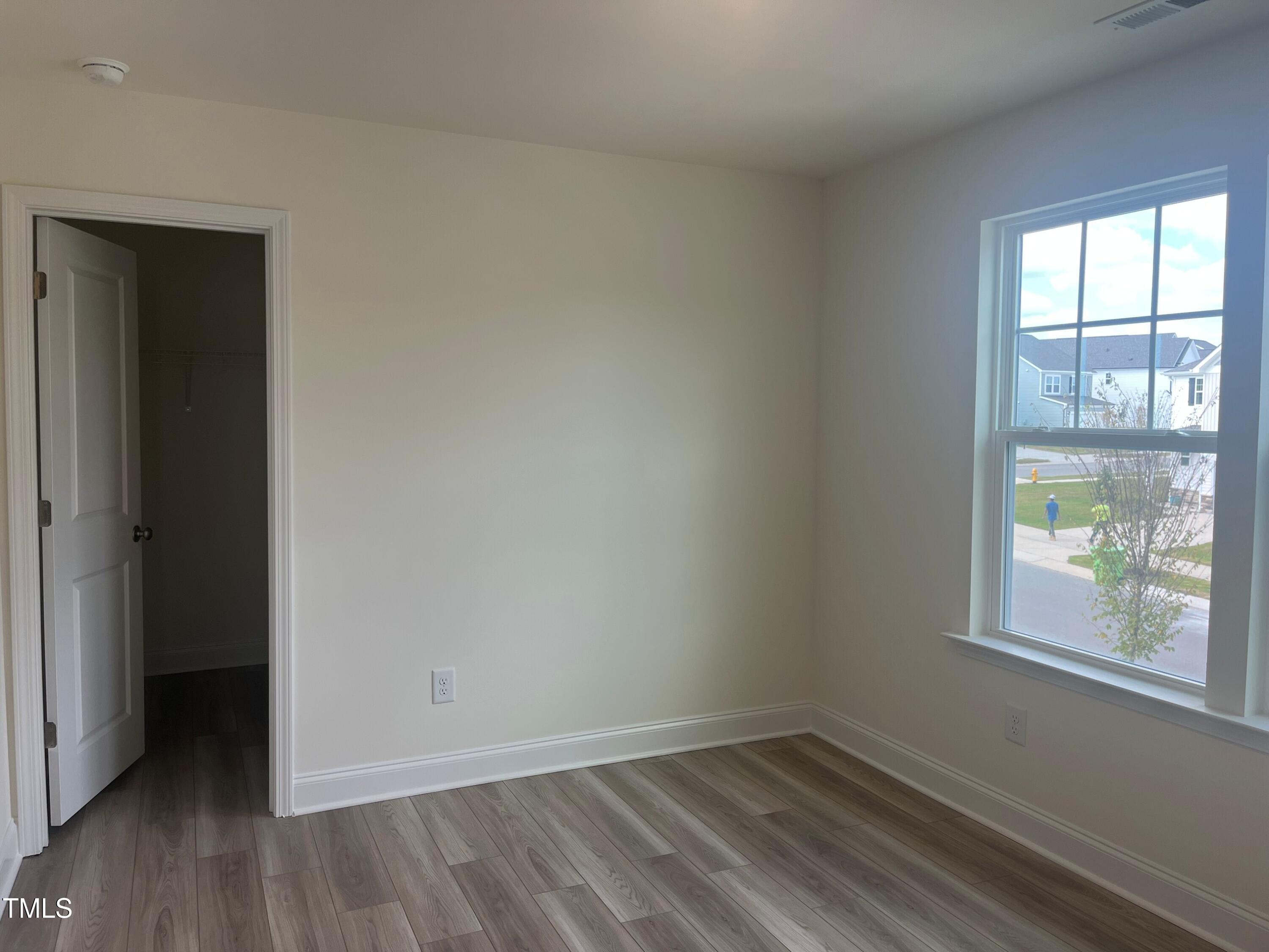 5108 River Sand Trail Raleigh, NC 27604 - Photo 38 of 59 an empty room with wooden floor and windows