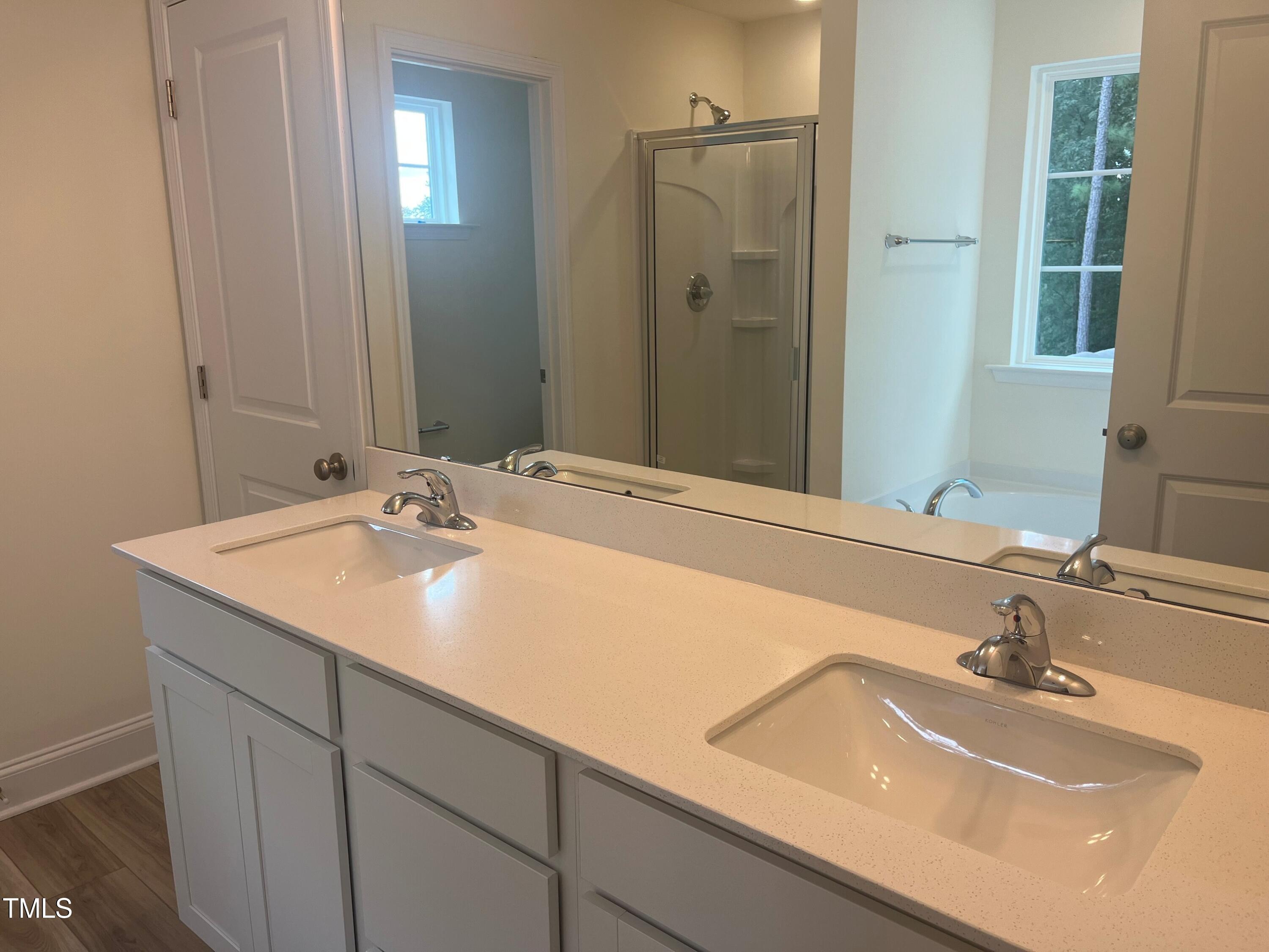 5108 River Sand Trail Raleigh, NC 27604 - Photo 41 of 59 a bathroom with a sink and a mirror