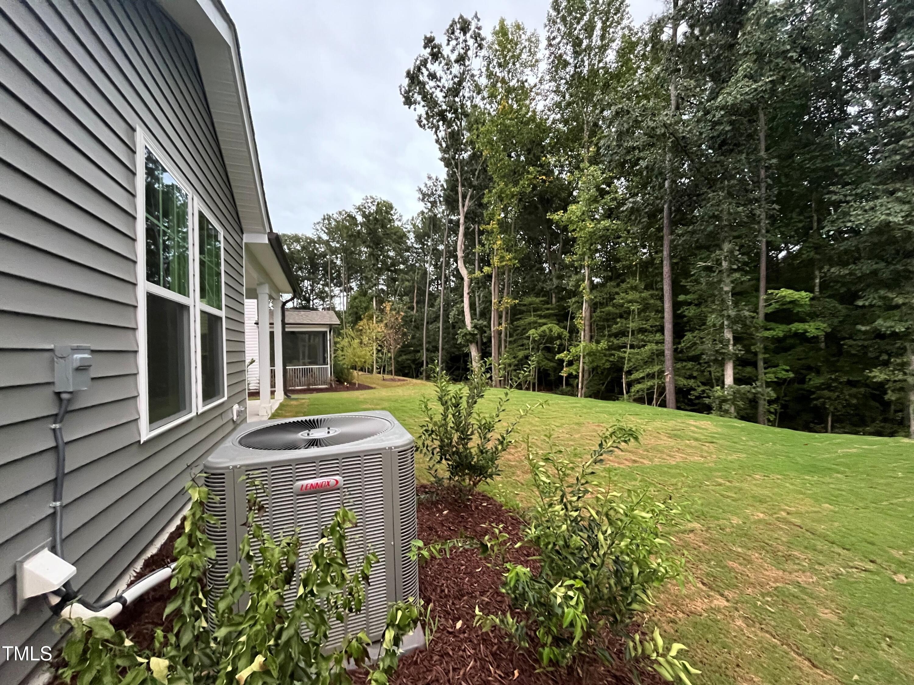 5108 River Sand Trail Raleigh, NC 27604 - Photo 47 of 59 a view of a yard with plants and trees