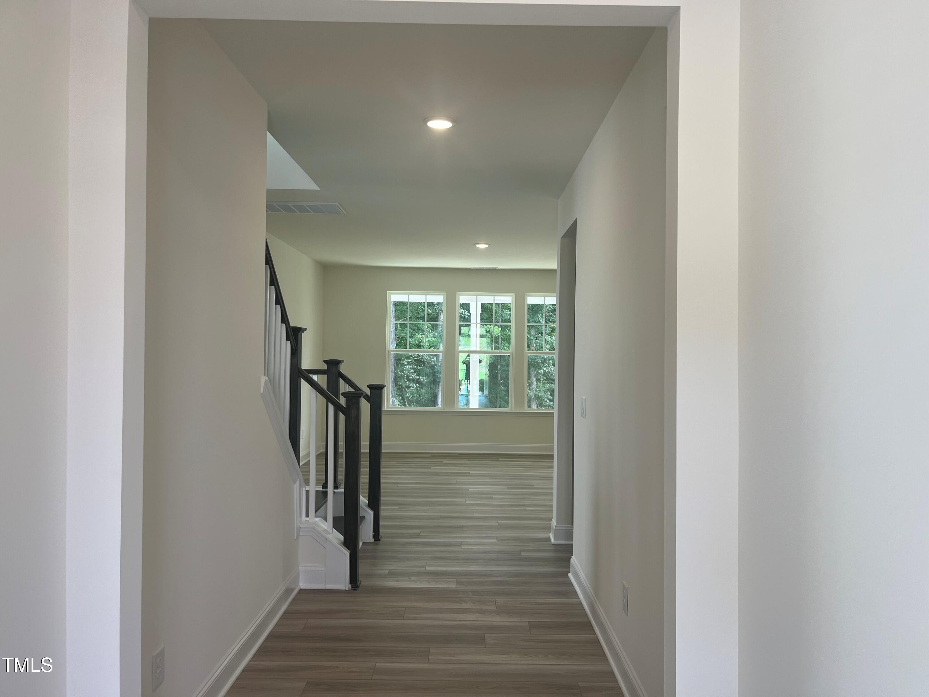5108 River Sand Trail Raleigh, NC 27604 - Photo 8 of 59 a view of a hallway with wooden floor and entryway