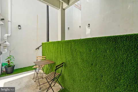 a backyard with table and chairs
