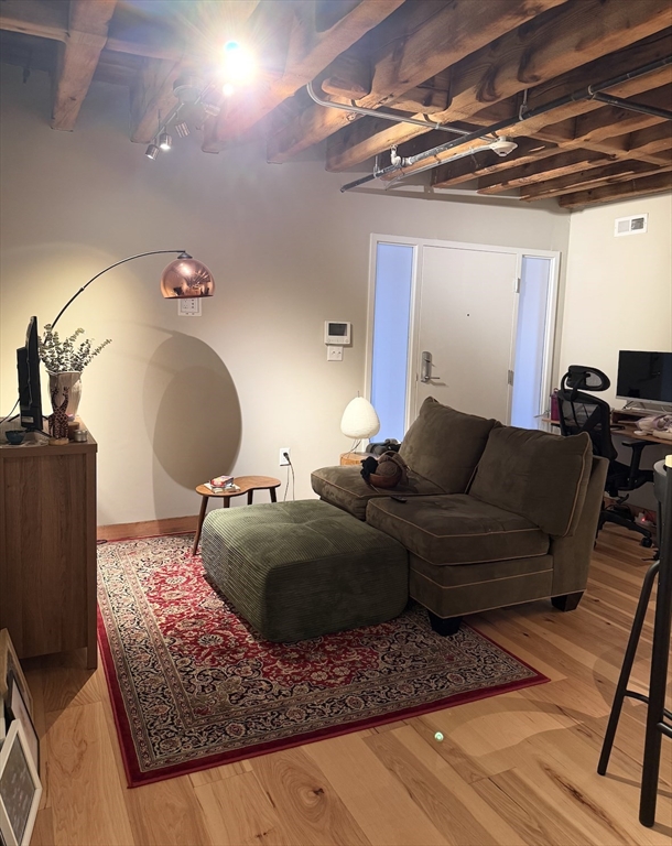 58 13th Street, Unit 112 Boston, MA 02129 - Photo 9 of 11 a living room with furniture